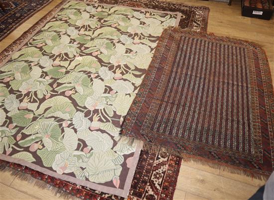 A crewel work rug, made by Portuguese prisoners and a Caucasian rug